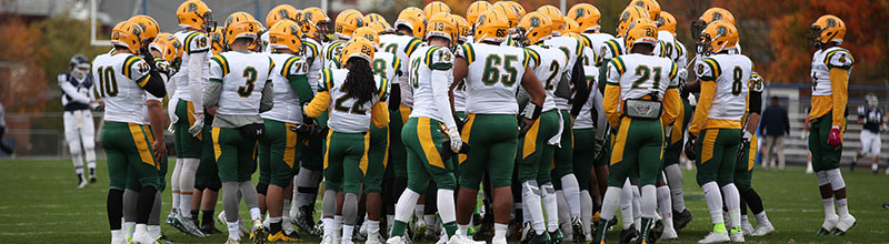 Brockport Football in a huddle before the game