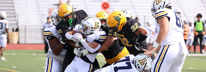 Brockport Defense pushing the ball carrier back