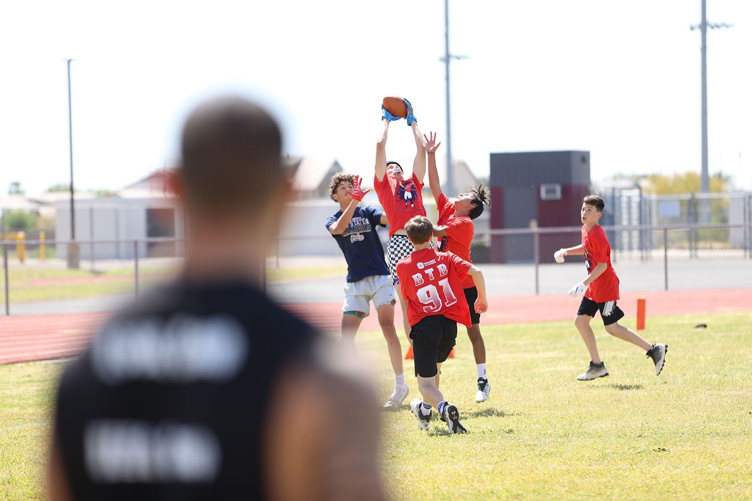 Camper going up for a contested catch