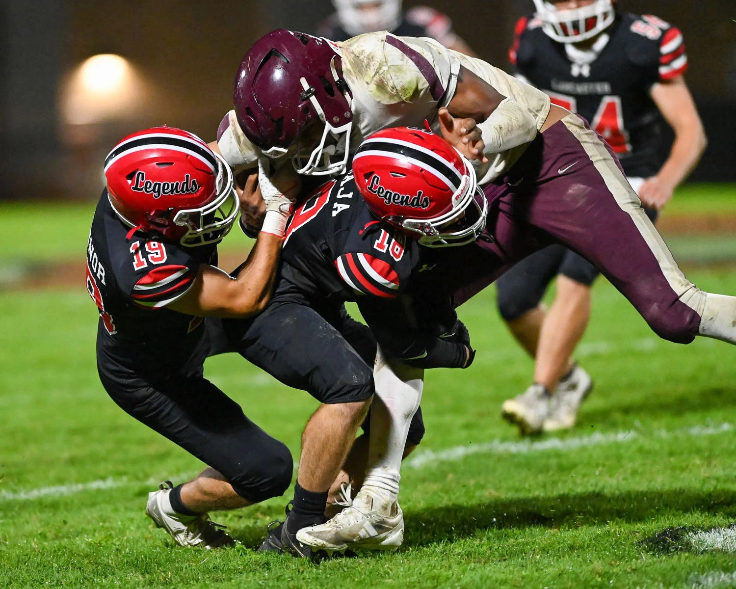 Legends bringing the RB down for the tackle