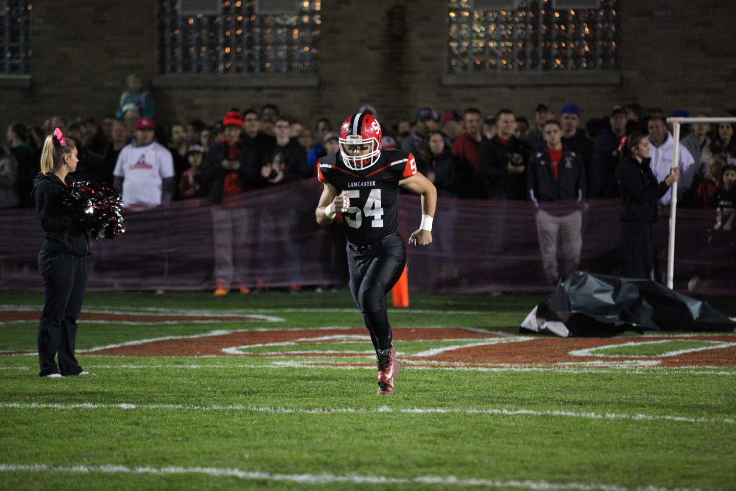 Joseph Molea running onto the field