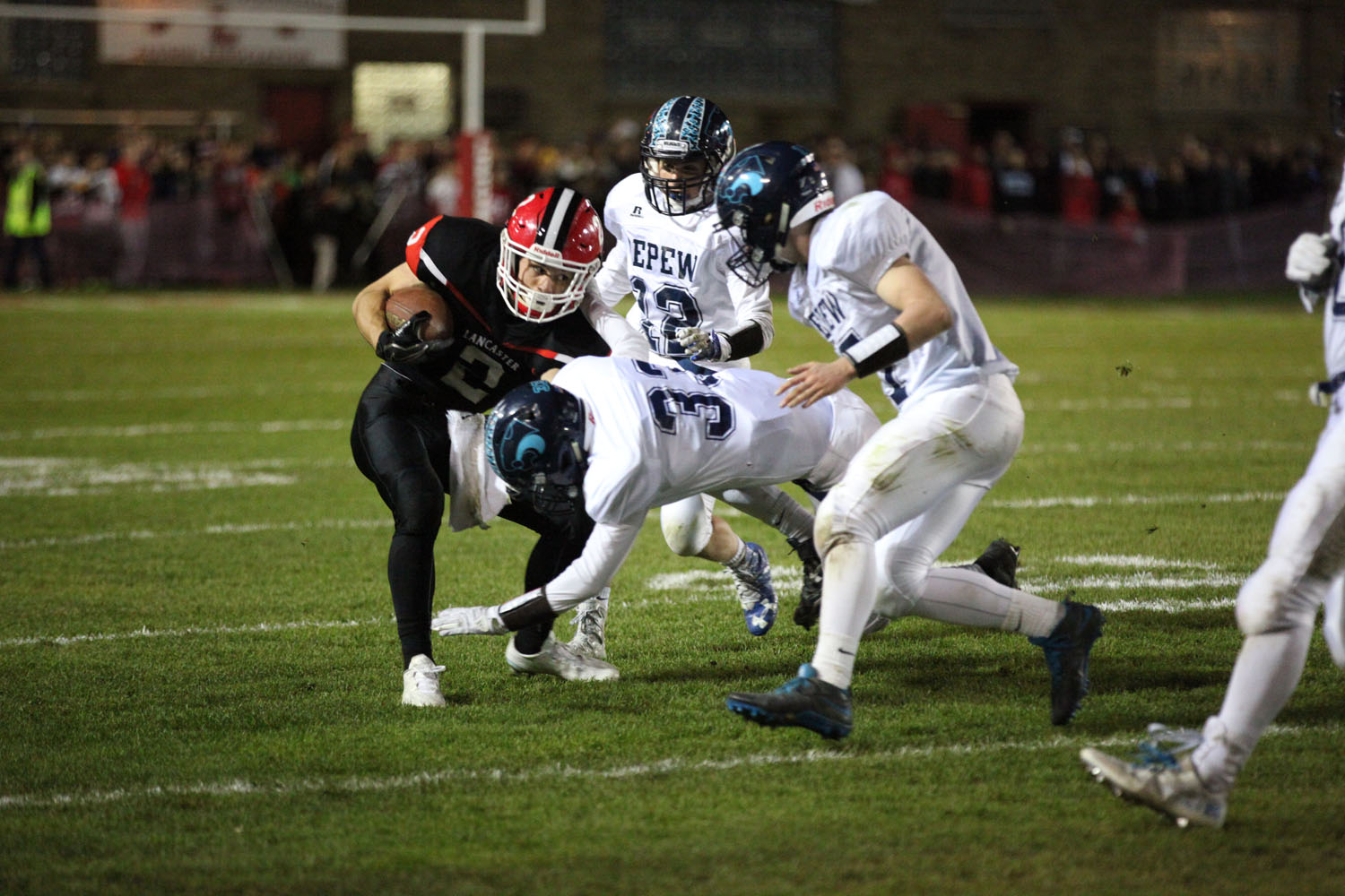 Zach trying to get loose from Depew Defenders