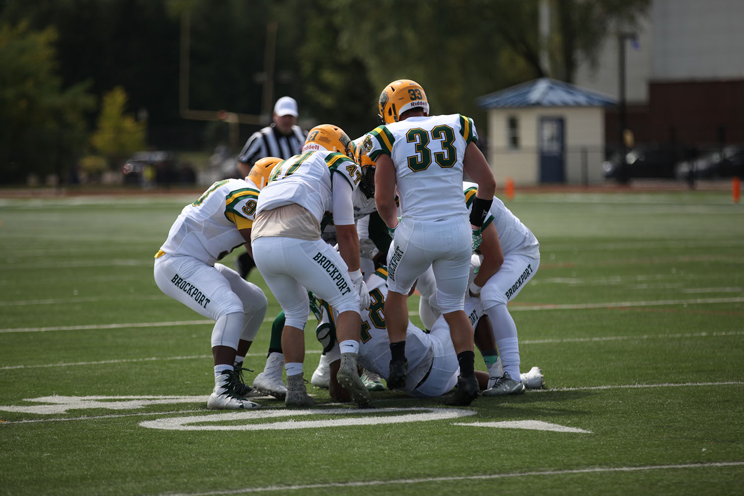 The Brockport Defense gets a turnover and helps up thier teammate