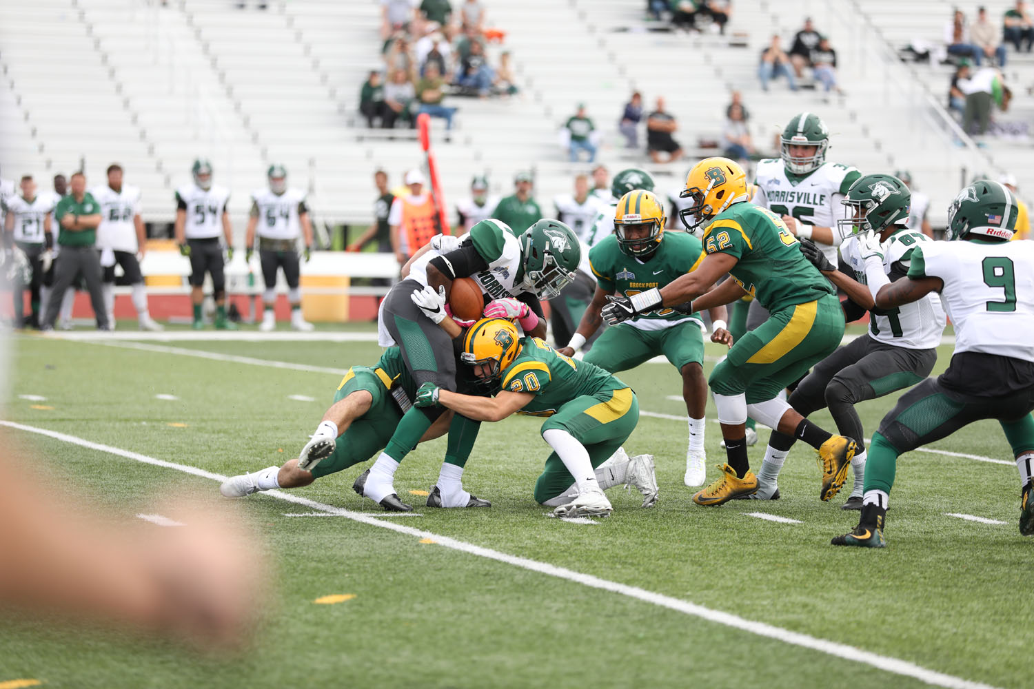 The Brockport defense swarms to the ball