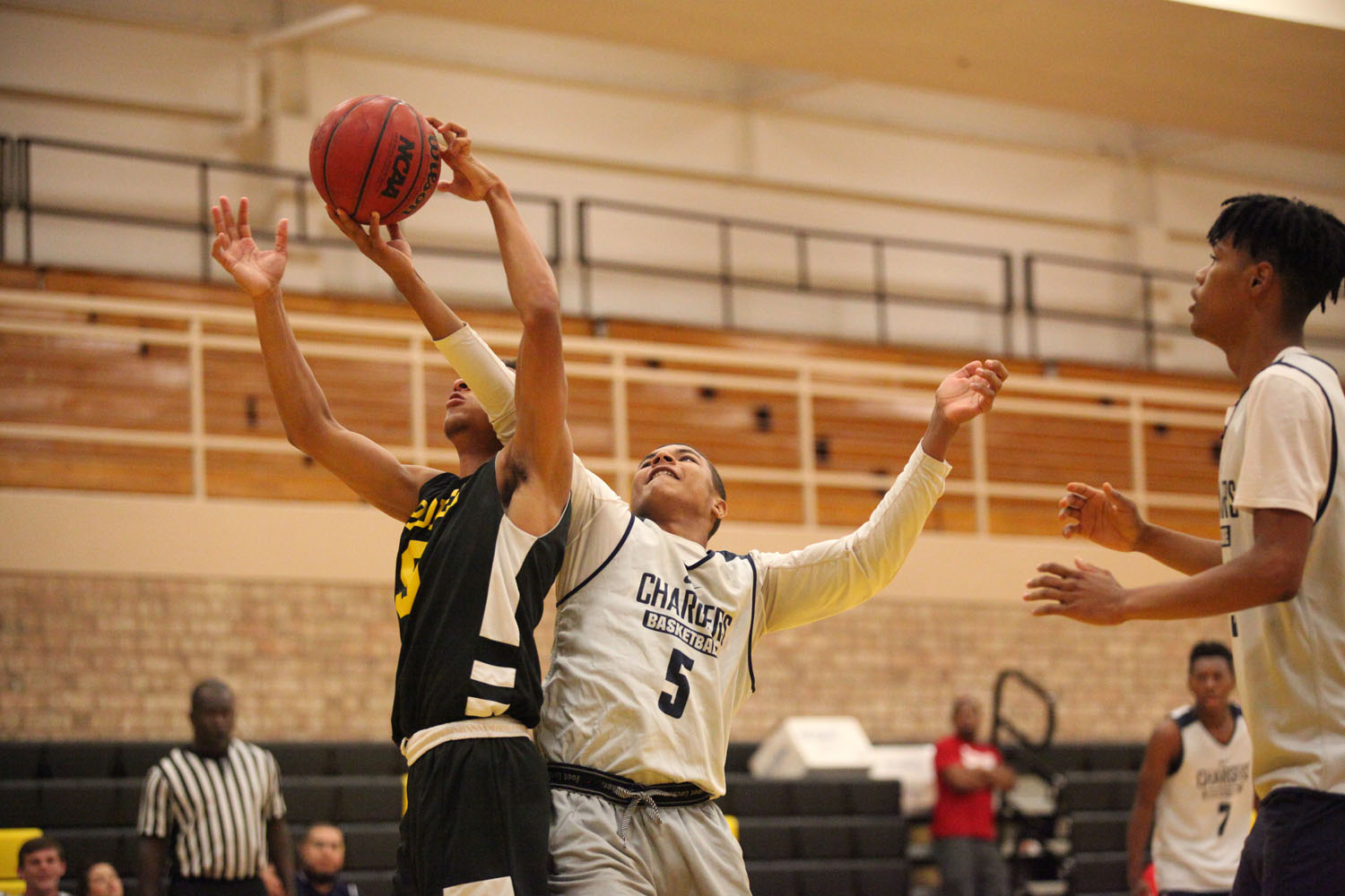 Two players going up for the rebound!