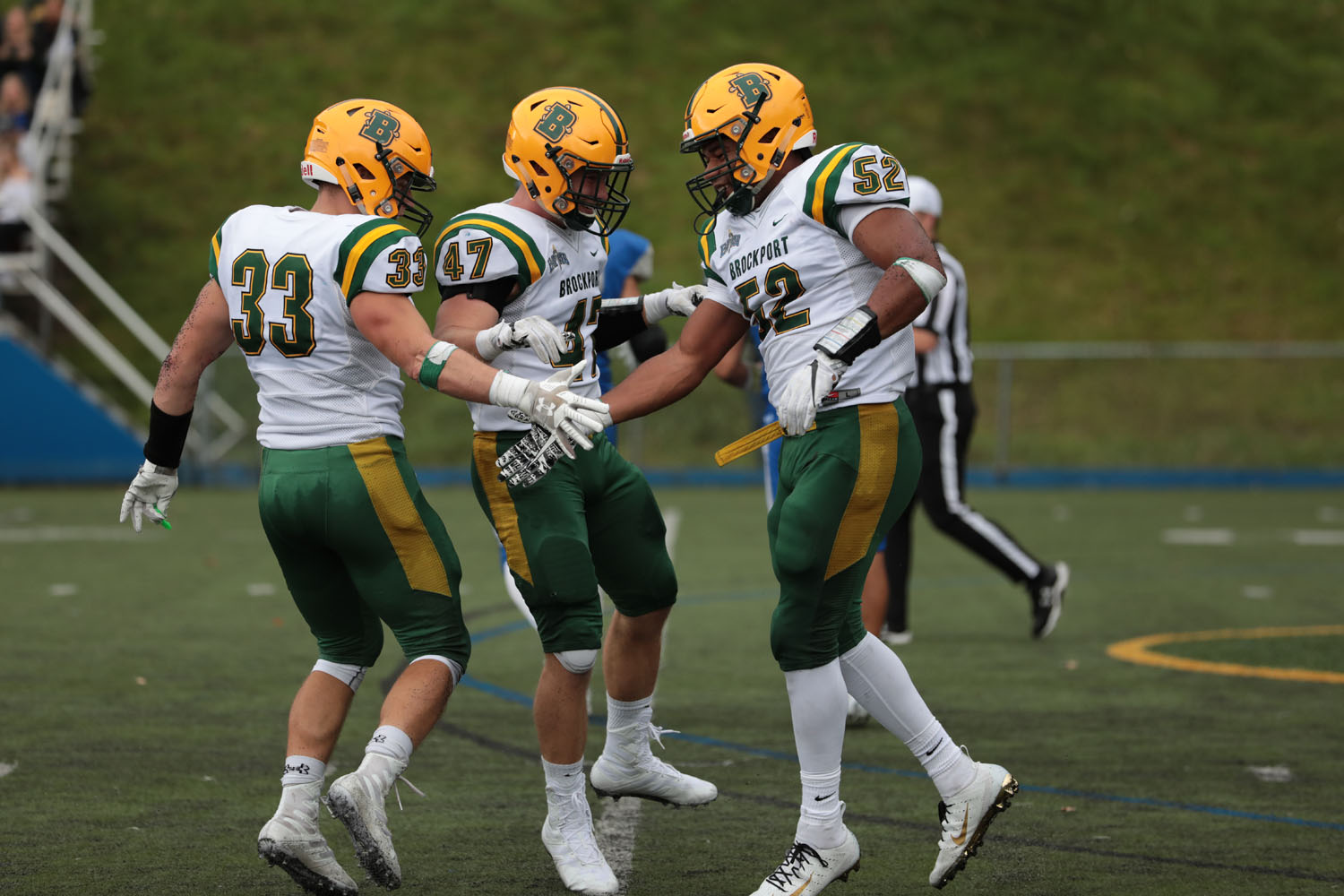 Defenders celebrating a sack against Hartwick