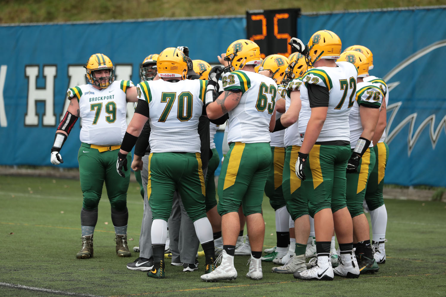 The offensive line huddle before the game