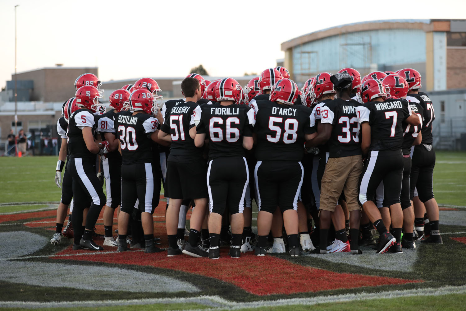 Lancaster huddle at midfield before the game