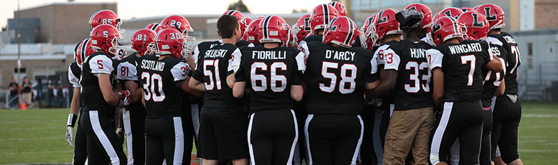 Lancaster Legends in a huddle at midfield