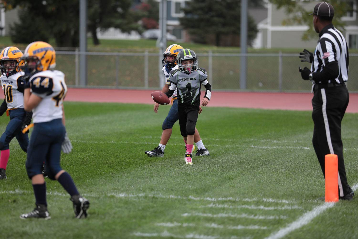 Brendan giving the ball to the ref after scoring the touchdown