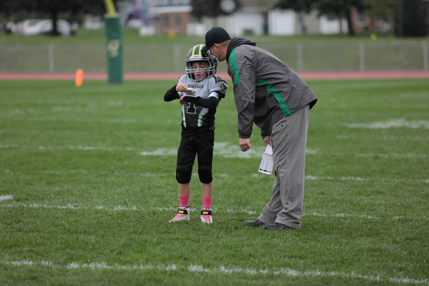 Brendan getting coached up by his coach