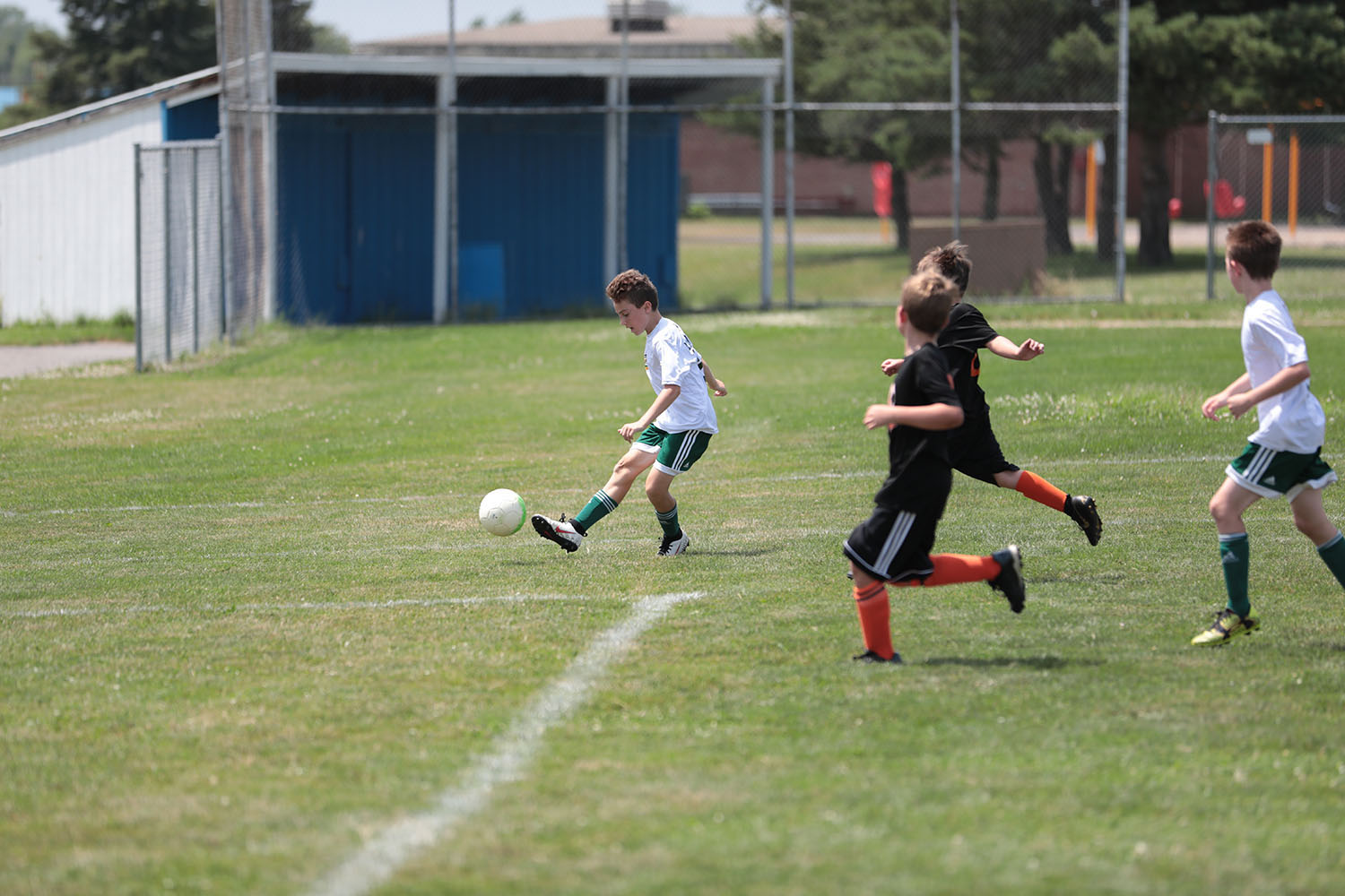 Brendan kicking the ball to the net