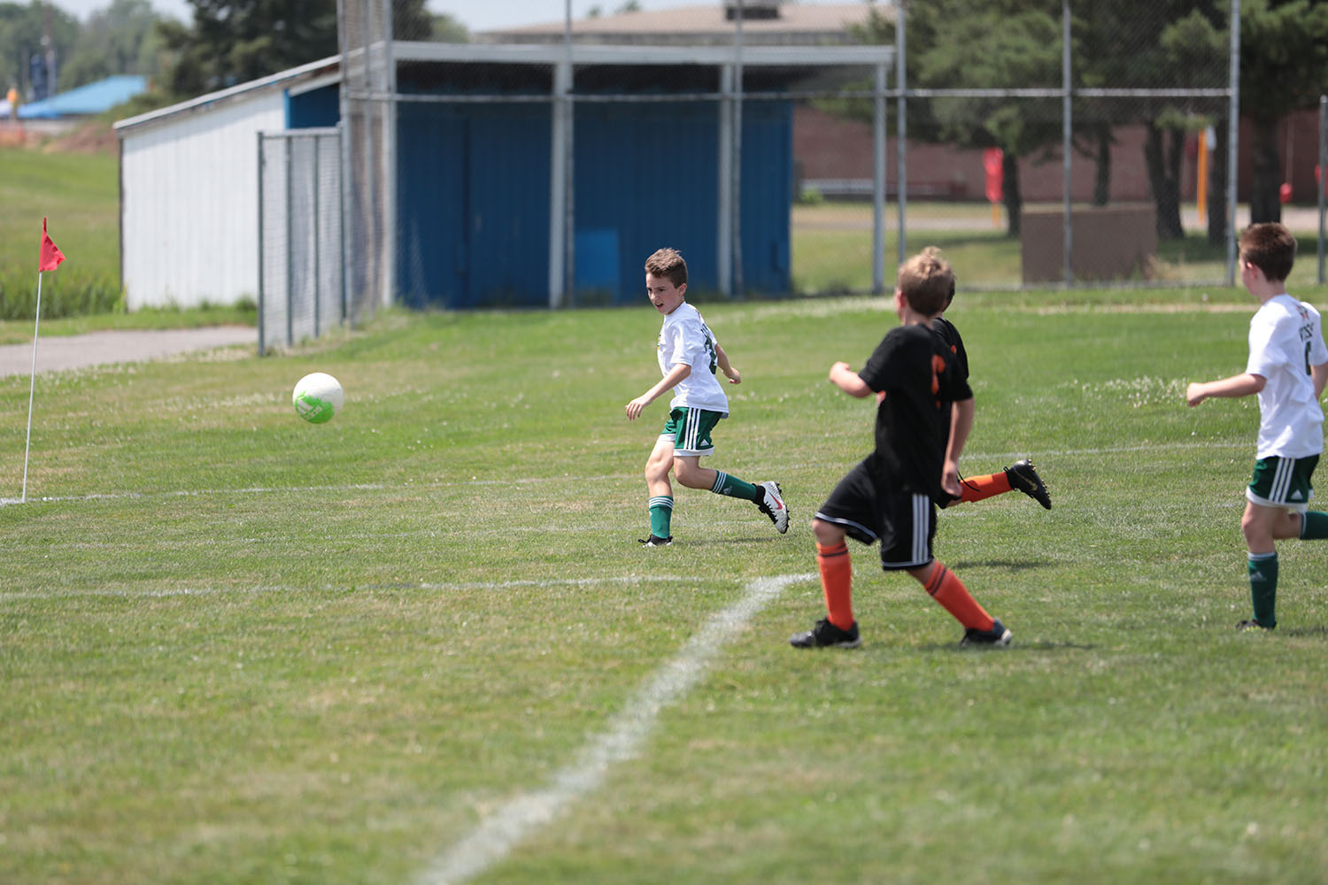 Brendan kicked the ball and watching where it goes