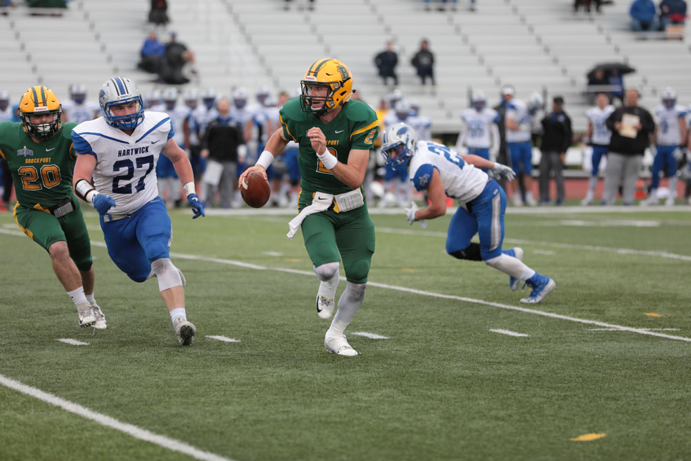 QB Jason Hellwig running away from trouble and looking down field