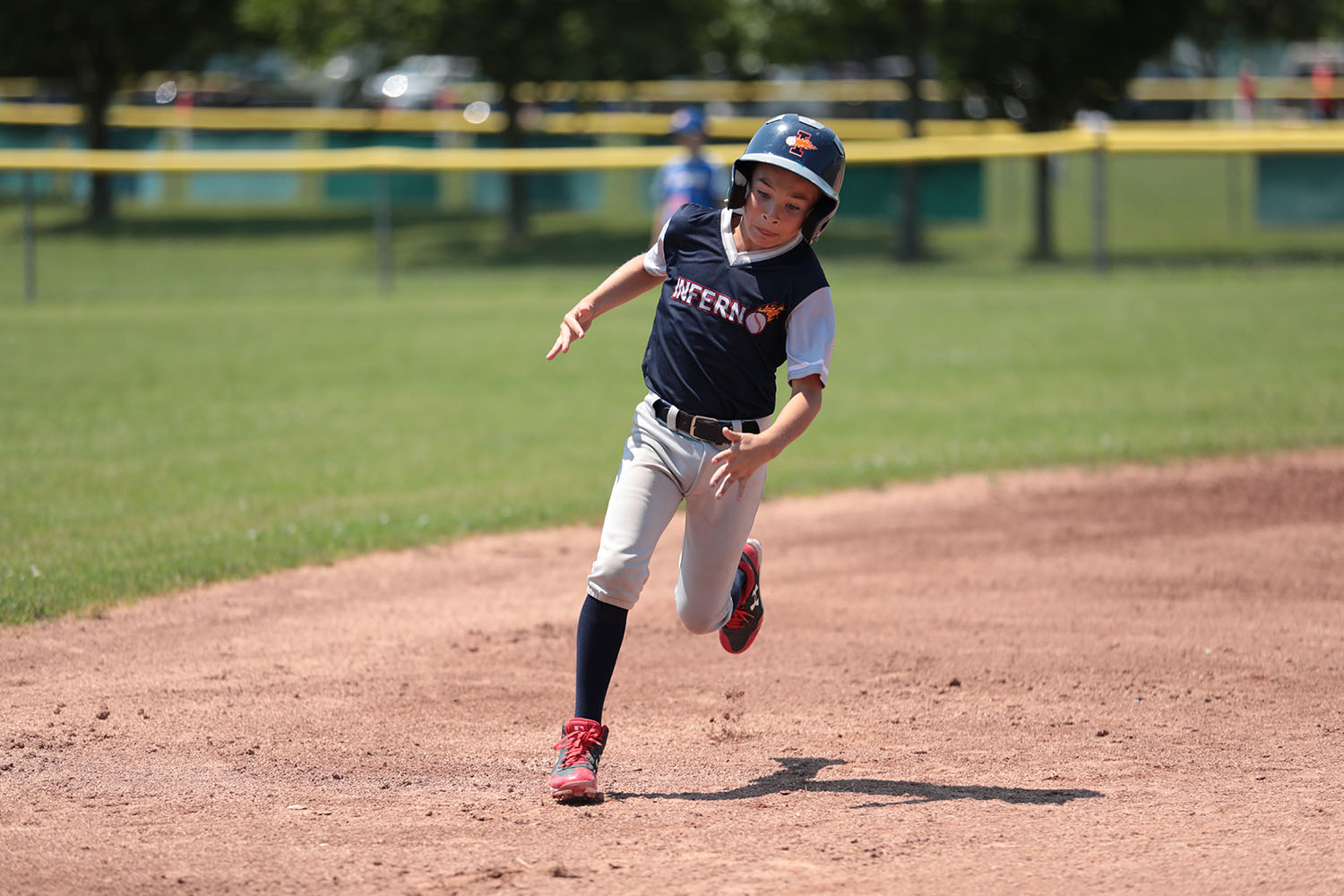 Parker about to round third base to get home