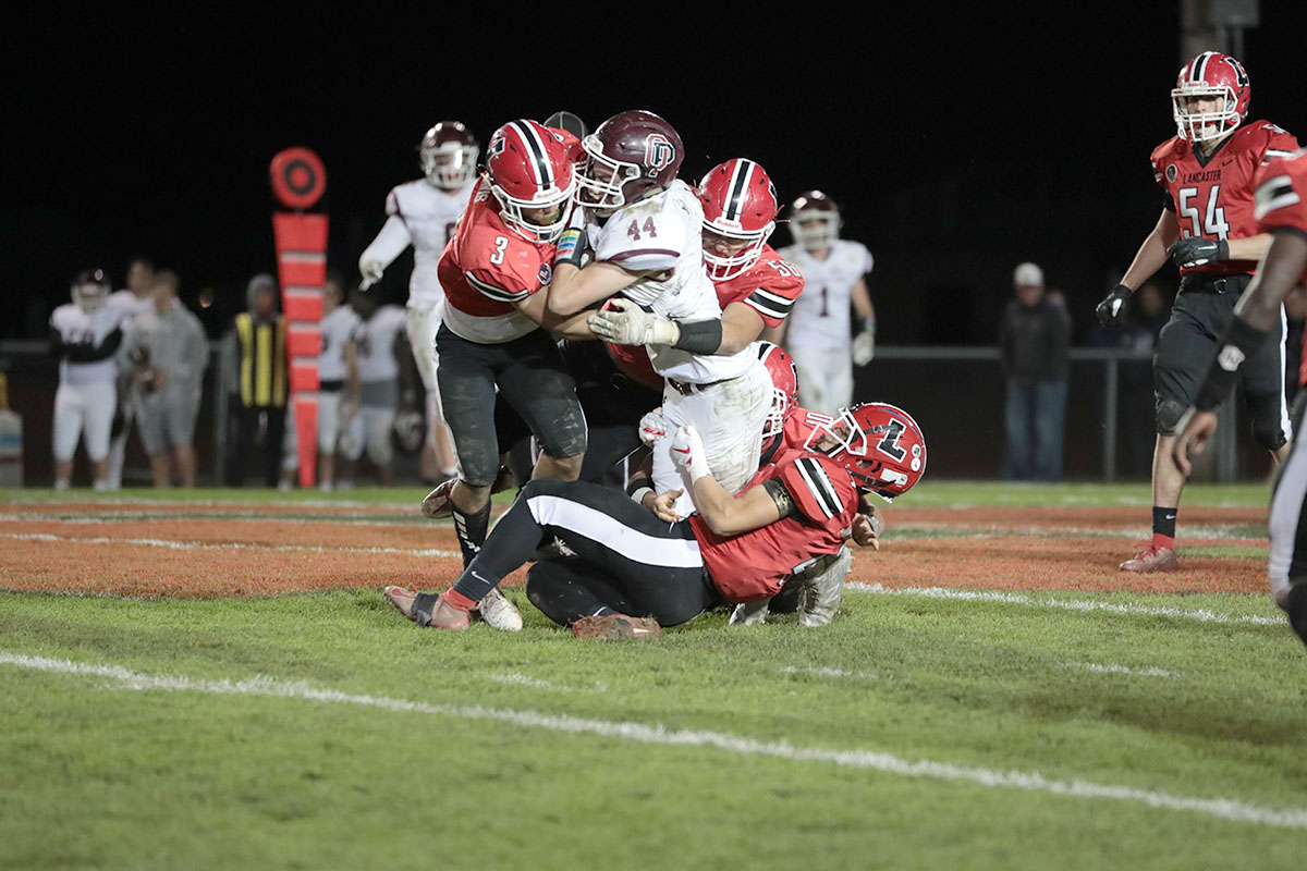 The Lancaster Defense makes the tackle