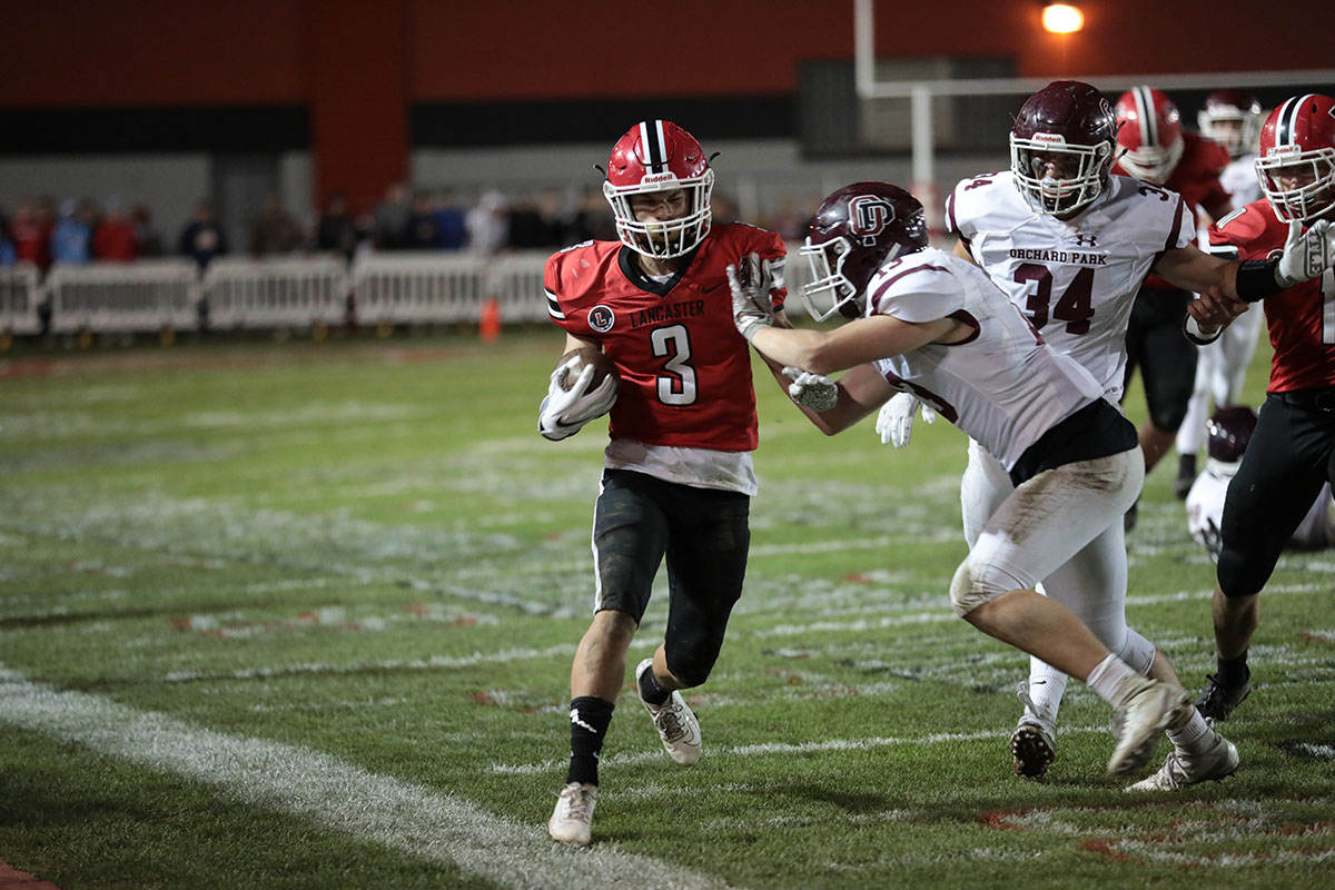 Shawn Davis being pushed out of bounds