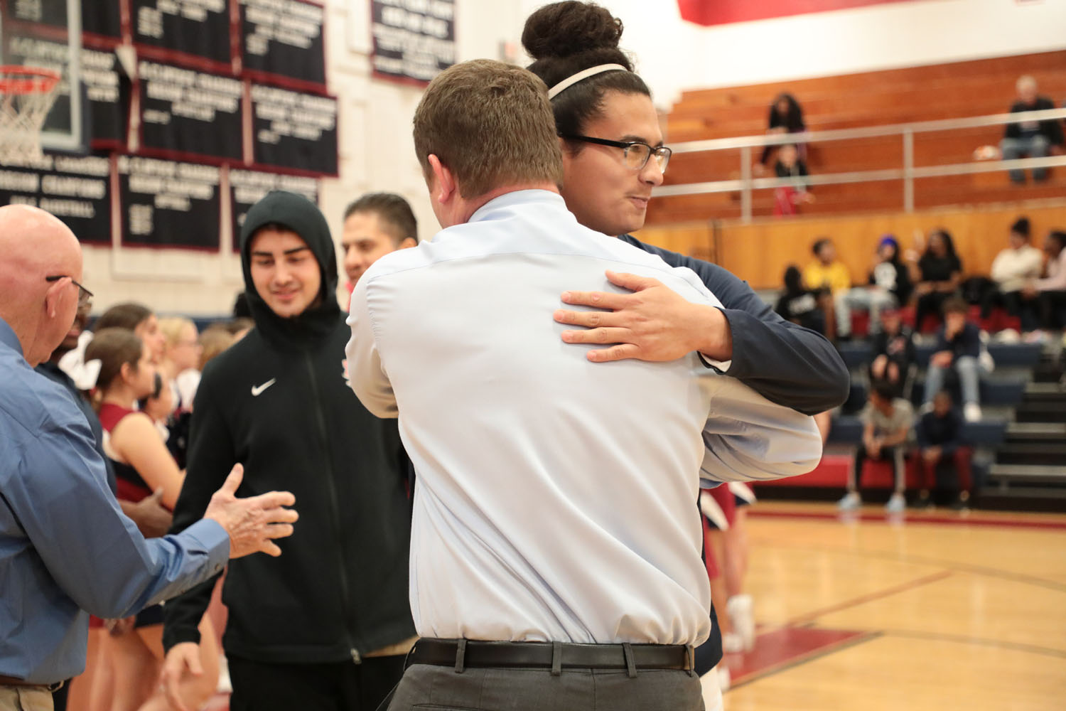 Xavier hugging coach on senior night