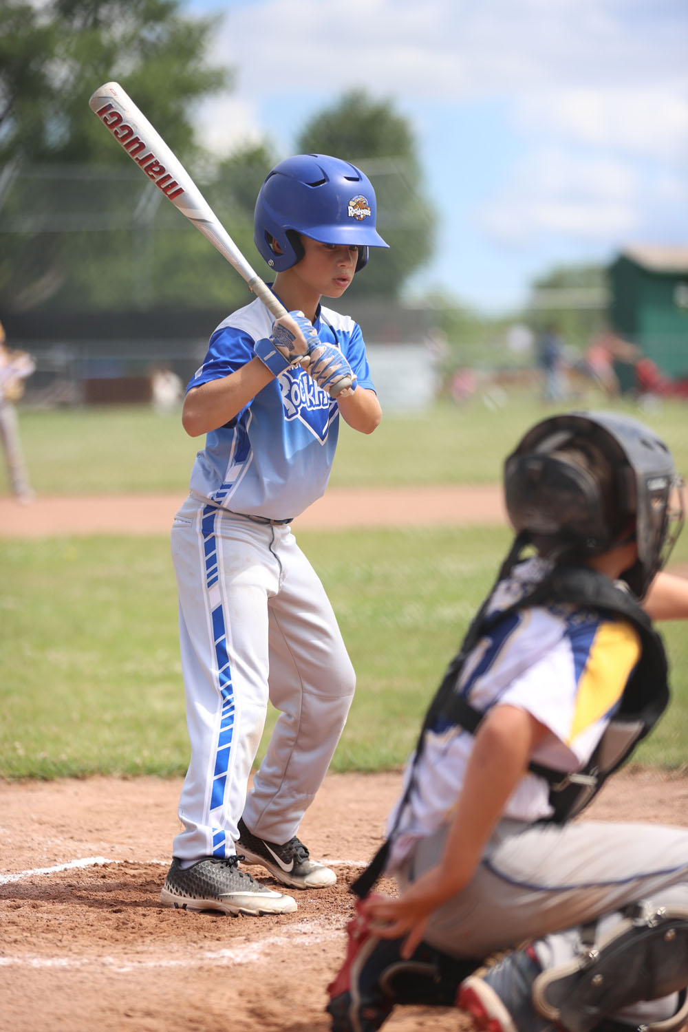 Evan watching the ball pass by to the catcher