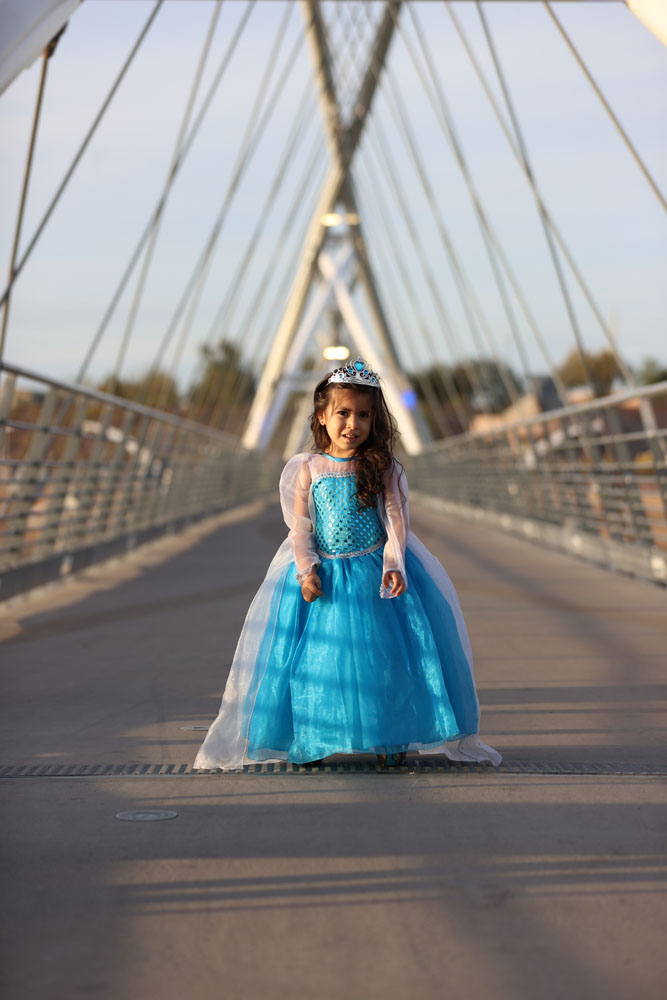 Andrea posing for the camera on a bridge at Tempe Town Lake