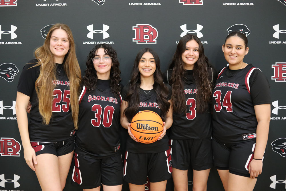 Girls Basketball players pose for the camera