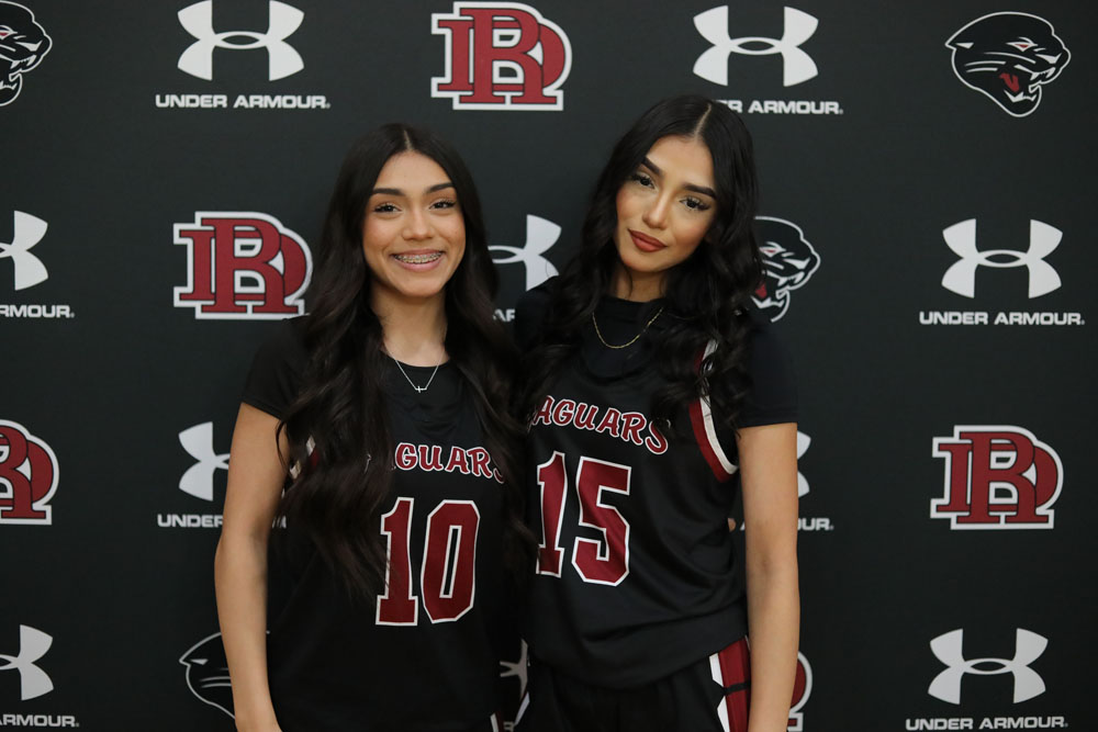 Sisters smiling for the camera on media day