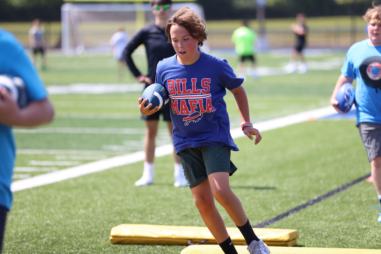 Camper running the drill with the ball