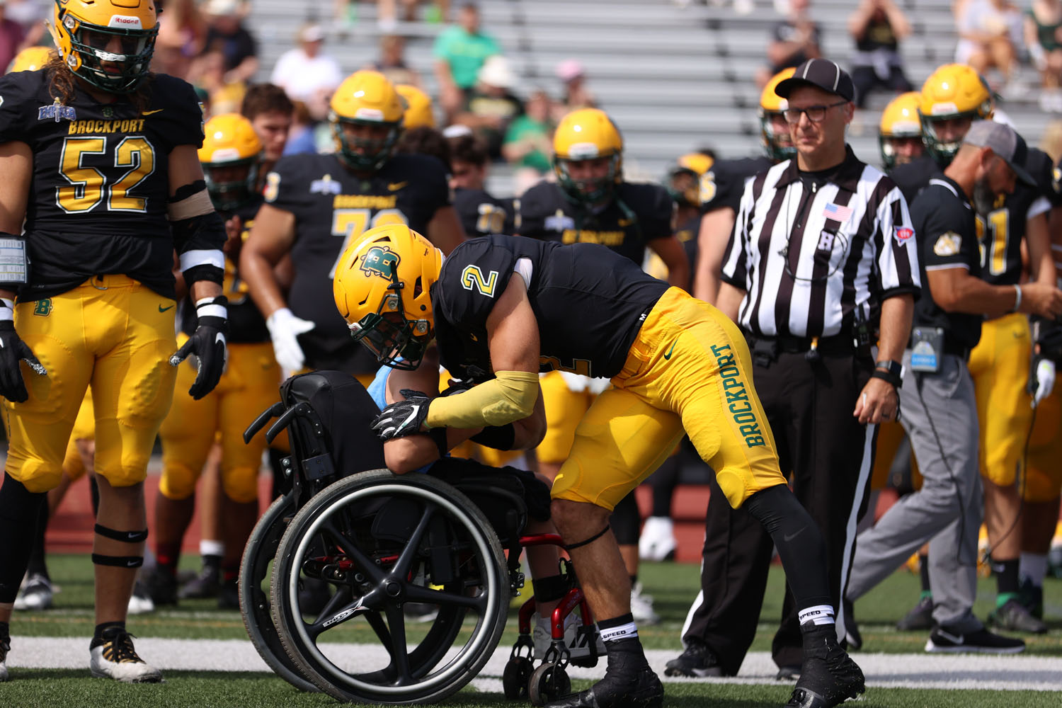 Jay pulling Ben in for a hug before the coin toss