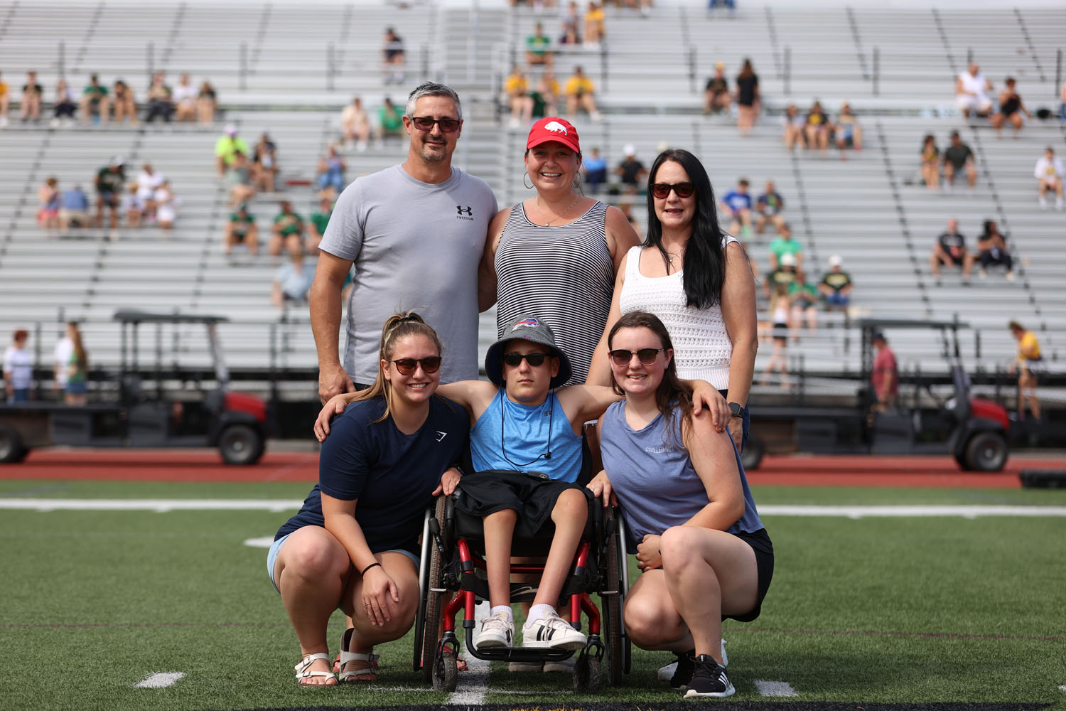 Jay and his family at midfield at Bob Boozer Field