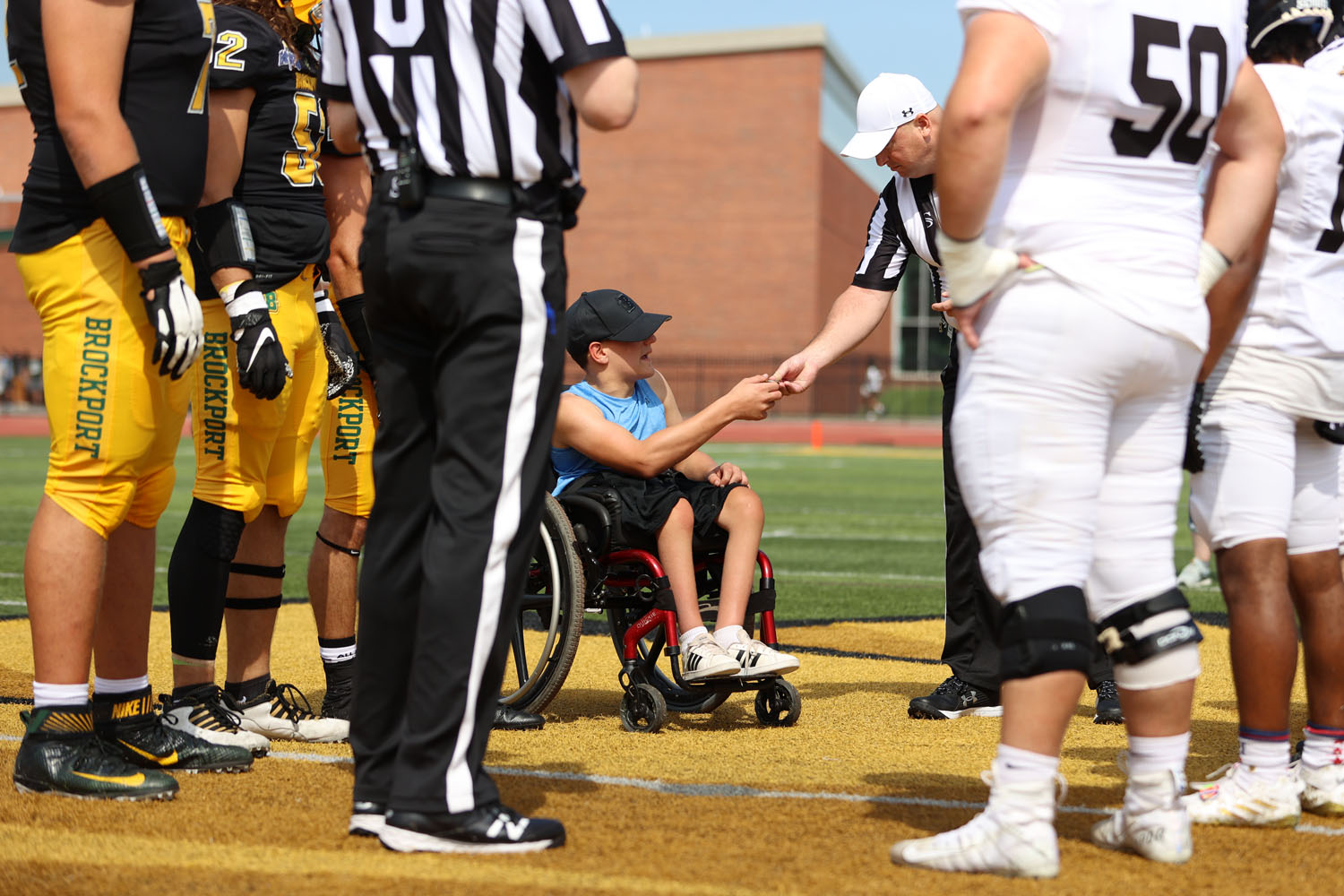 Jay receiving the coin from the head official