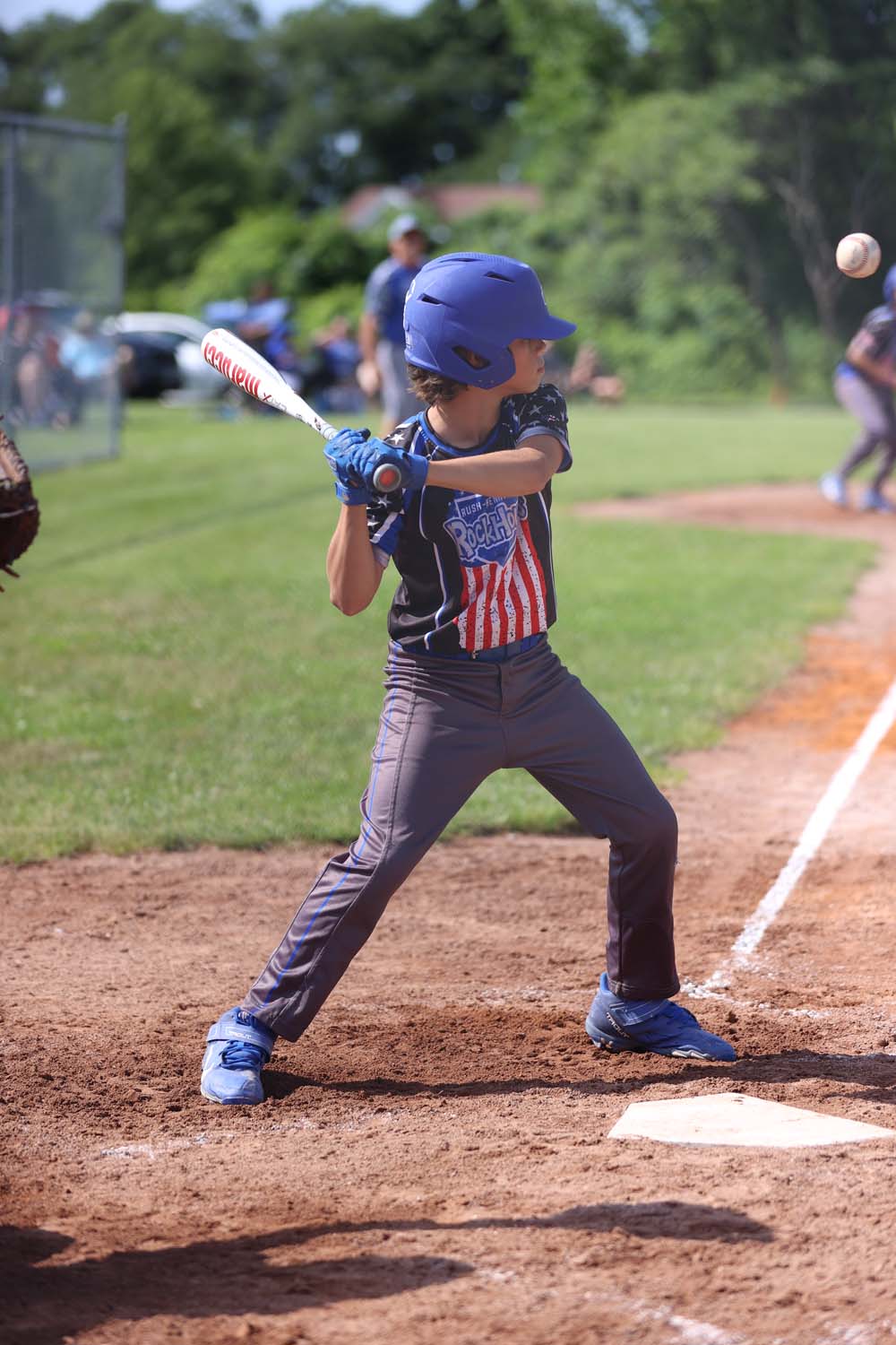 Evan at bat watching a ball go by