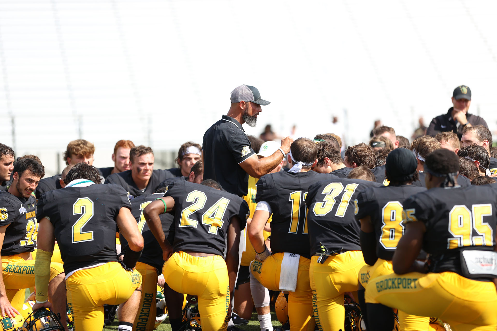 Brockport vs Framingham State- Coach Mangone talking to his team after a win