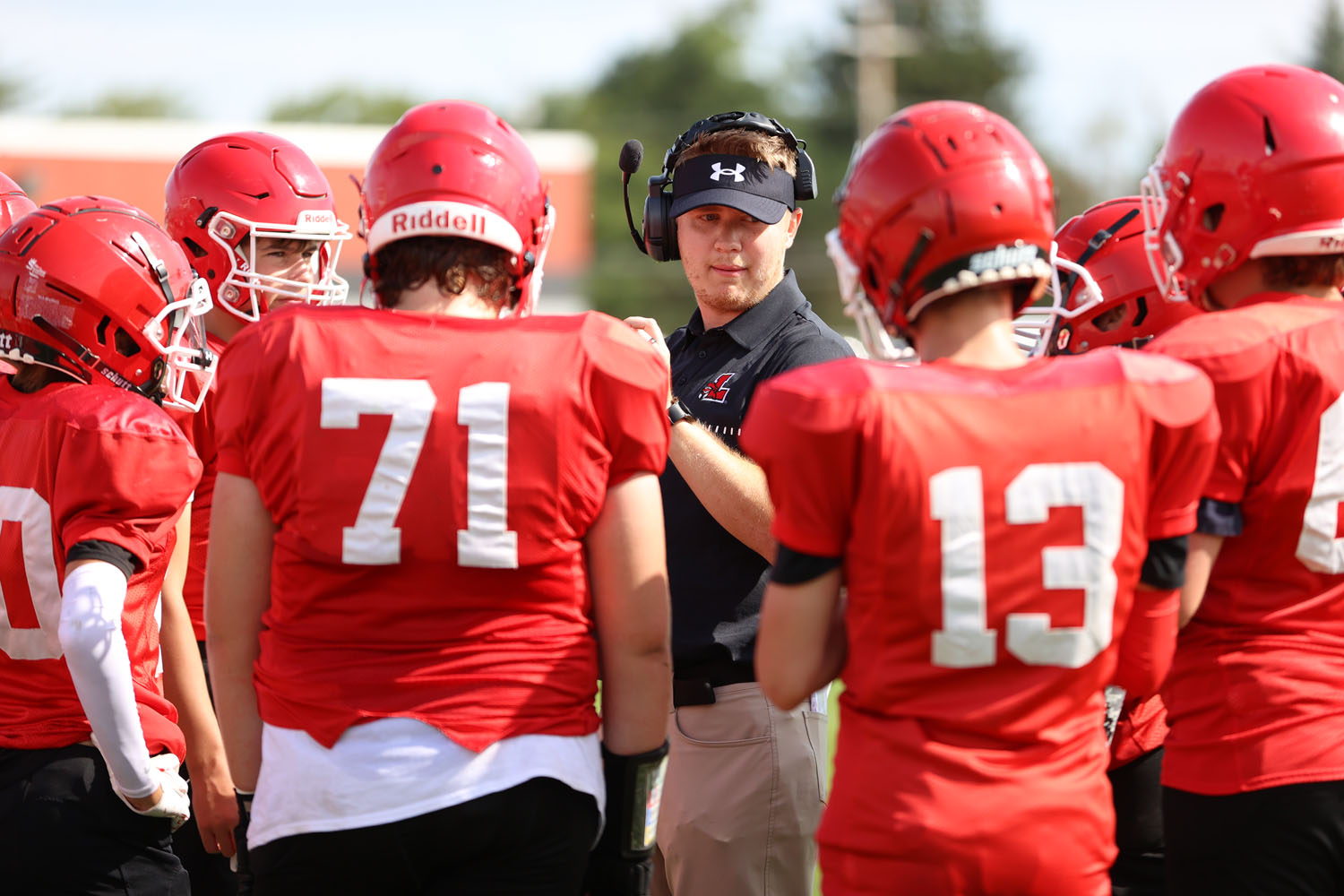 Coach talking to his team during a timeout