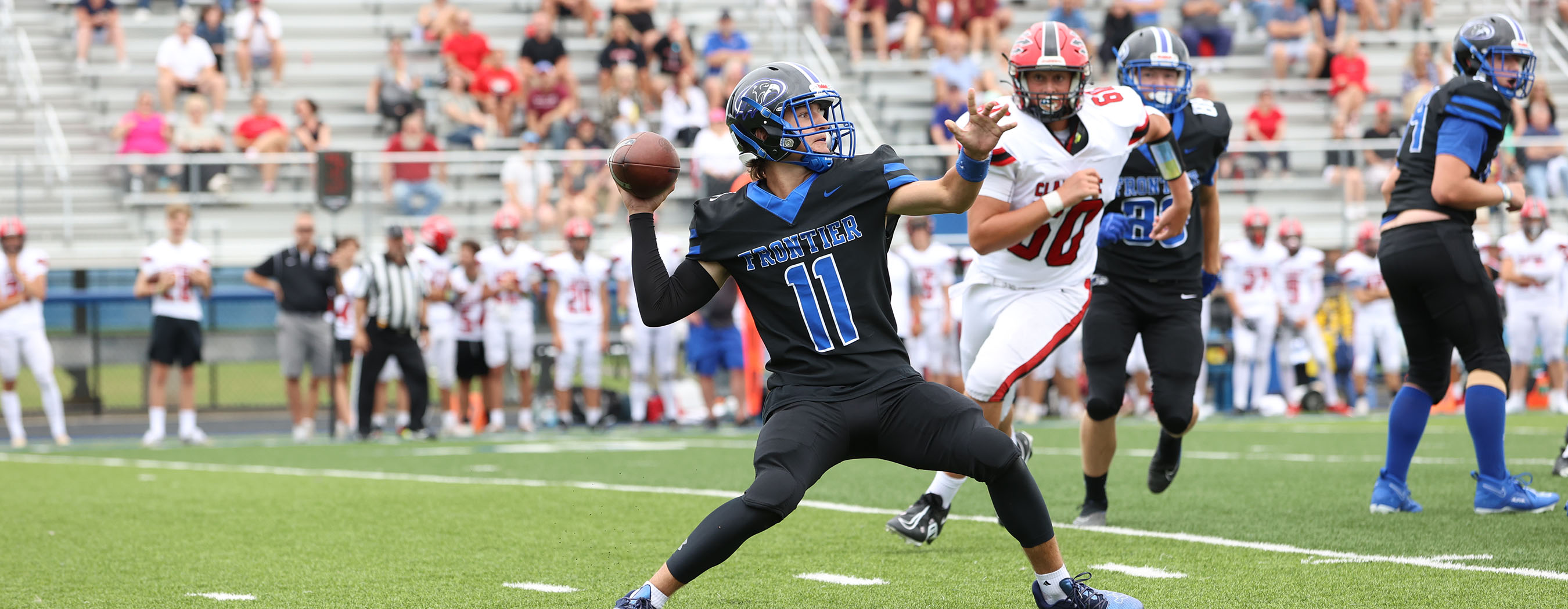 Frontier QB throwing the ball down the field