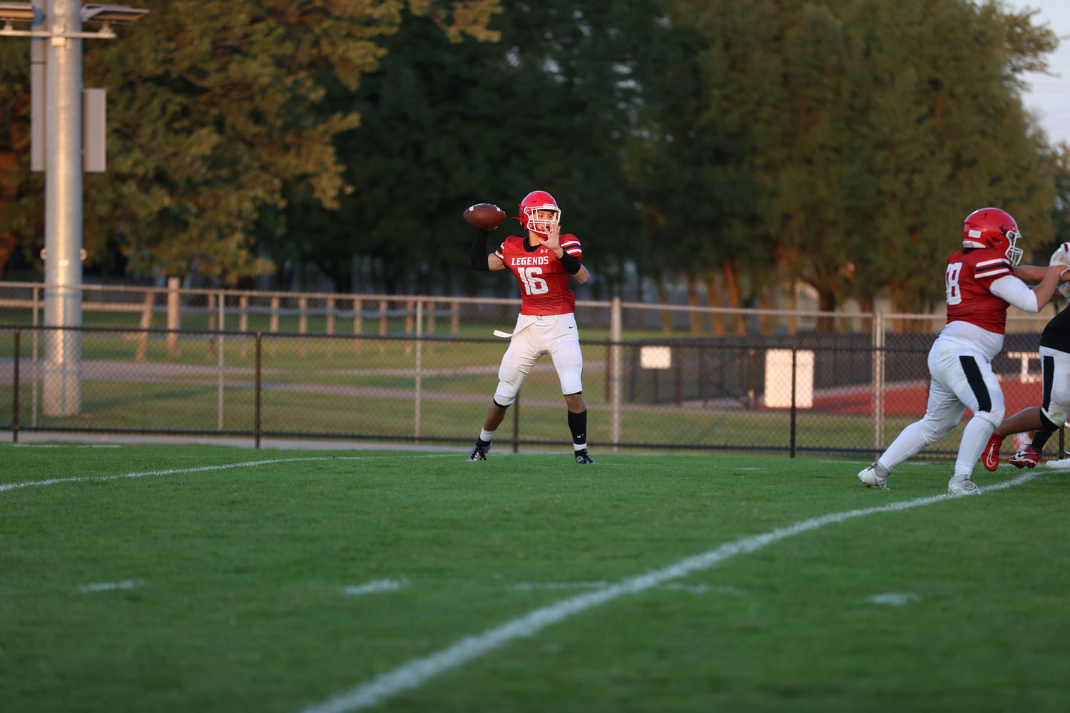 Lancaster QB throwing the ball to a teammate