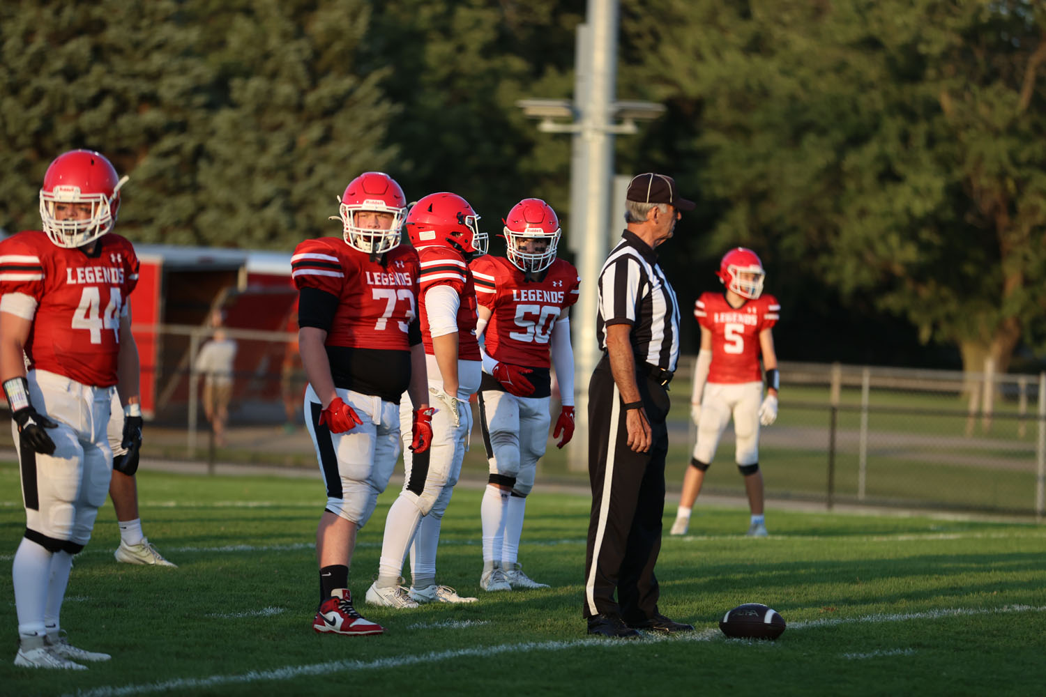 Teammates talking on defense inbetween plays