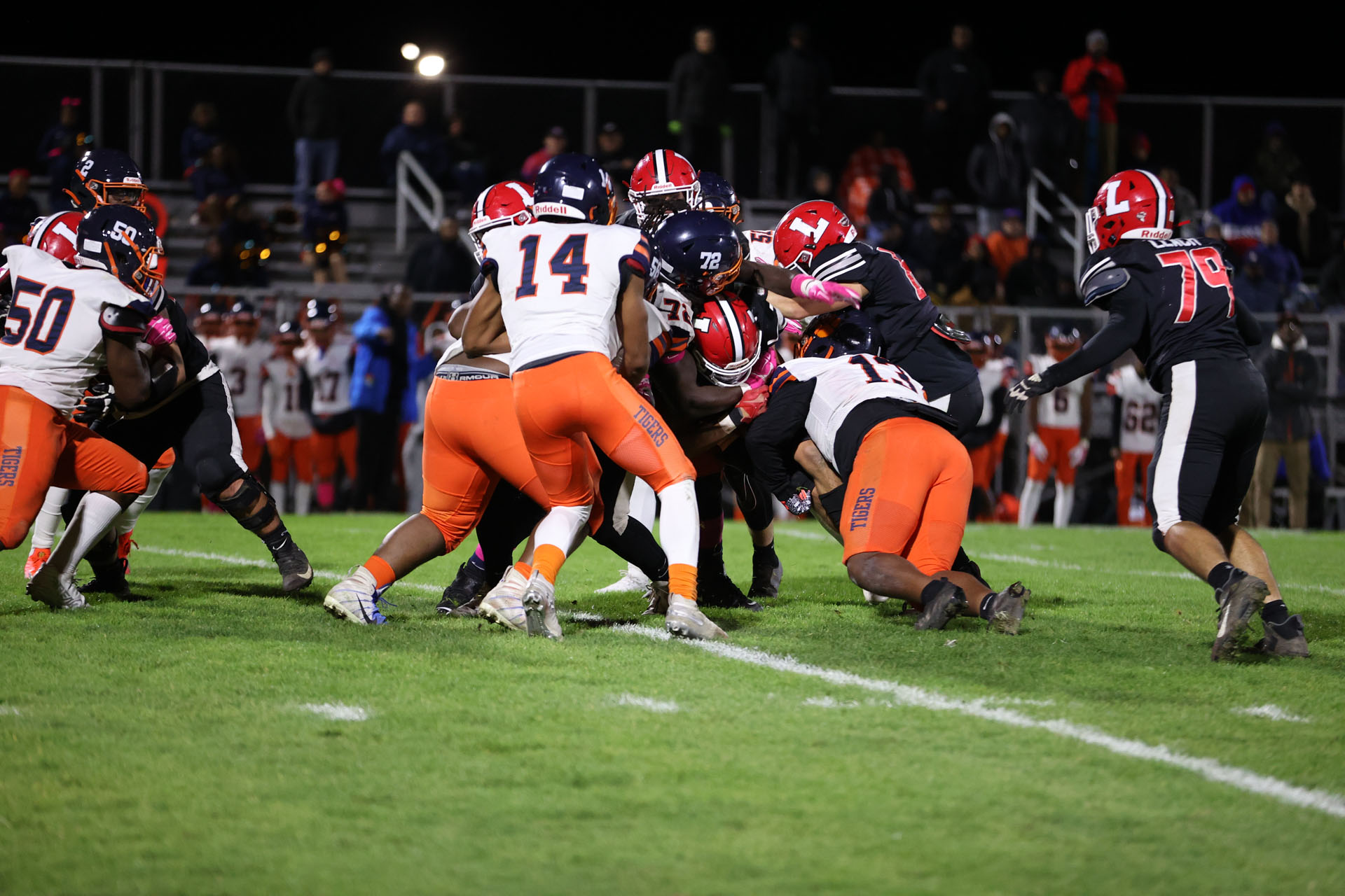 Bennett players tackle Lancaster Running Back