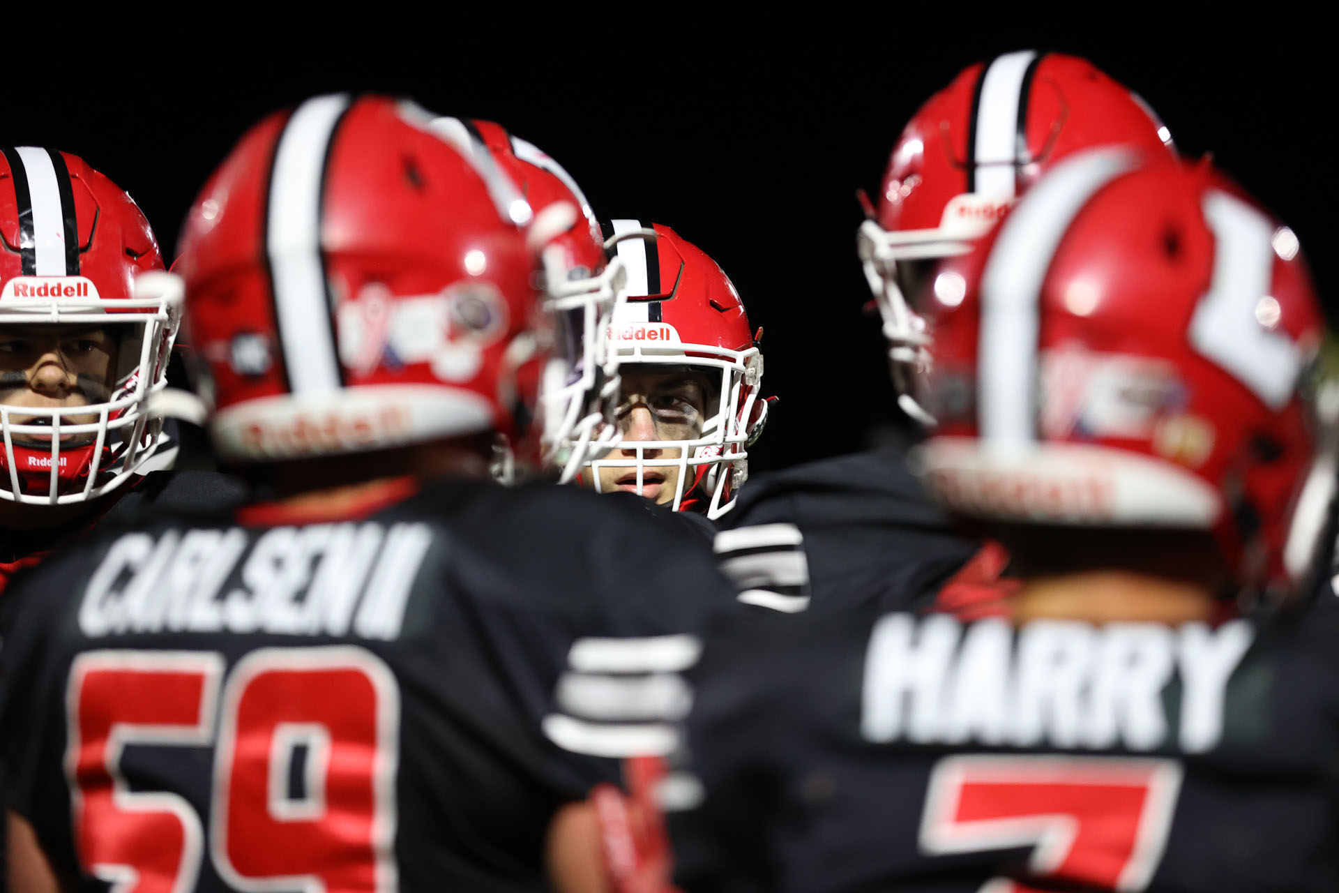 Lancaster player peeking out of the huddle