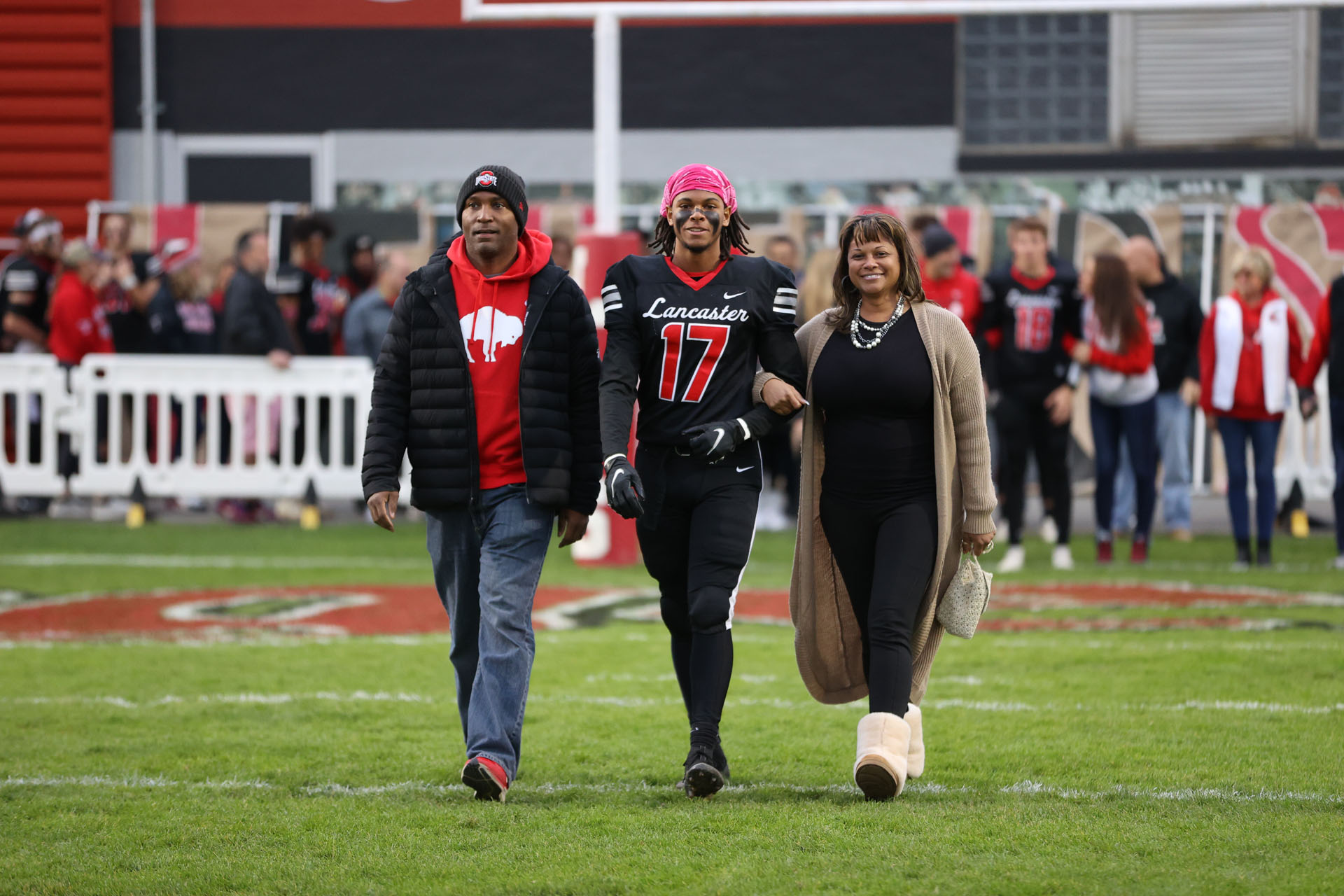 Lancaster Senior coming out on the field with his family