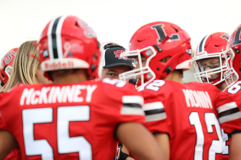 Coach Murphy talking to his players before the kickoff