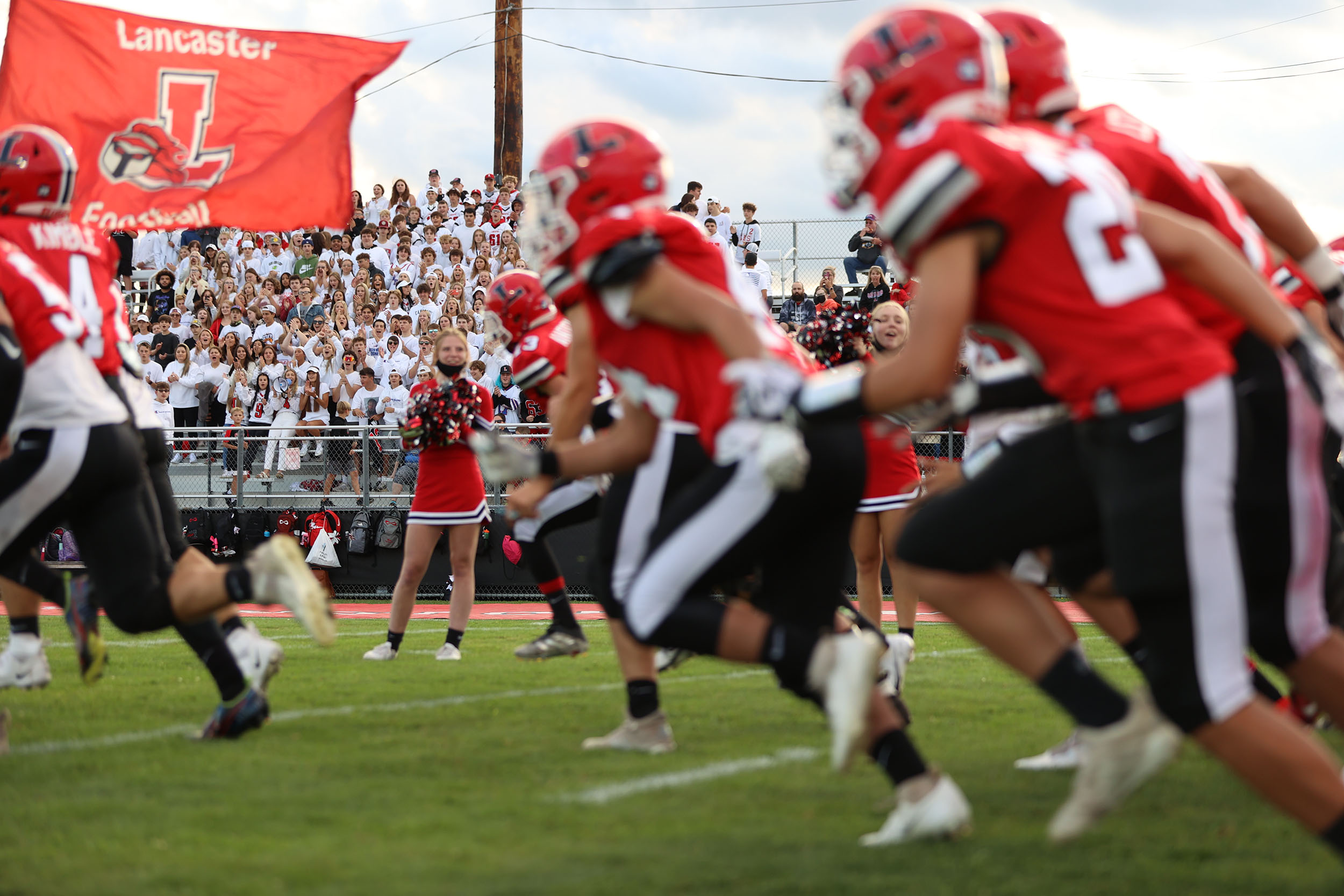 The Lancaster Football Team runs onto Foyle-Kling Field!