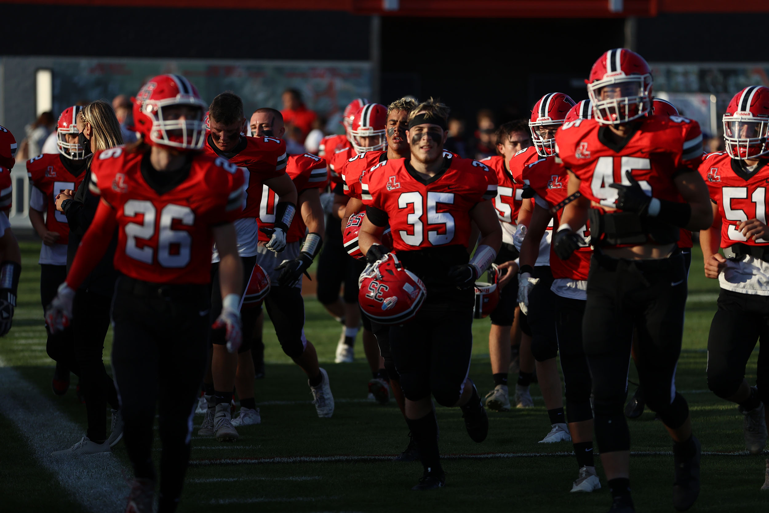 The Lancaster football team heading to the sidelines