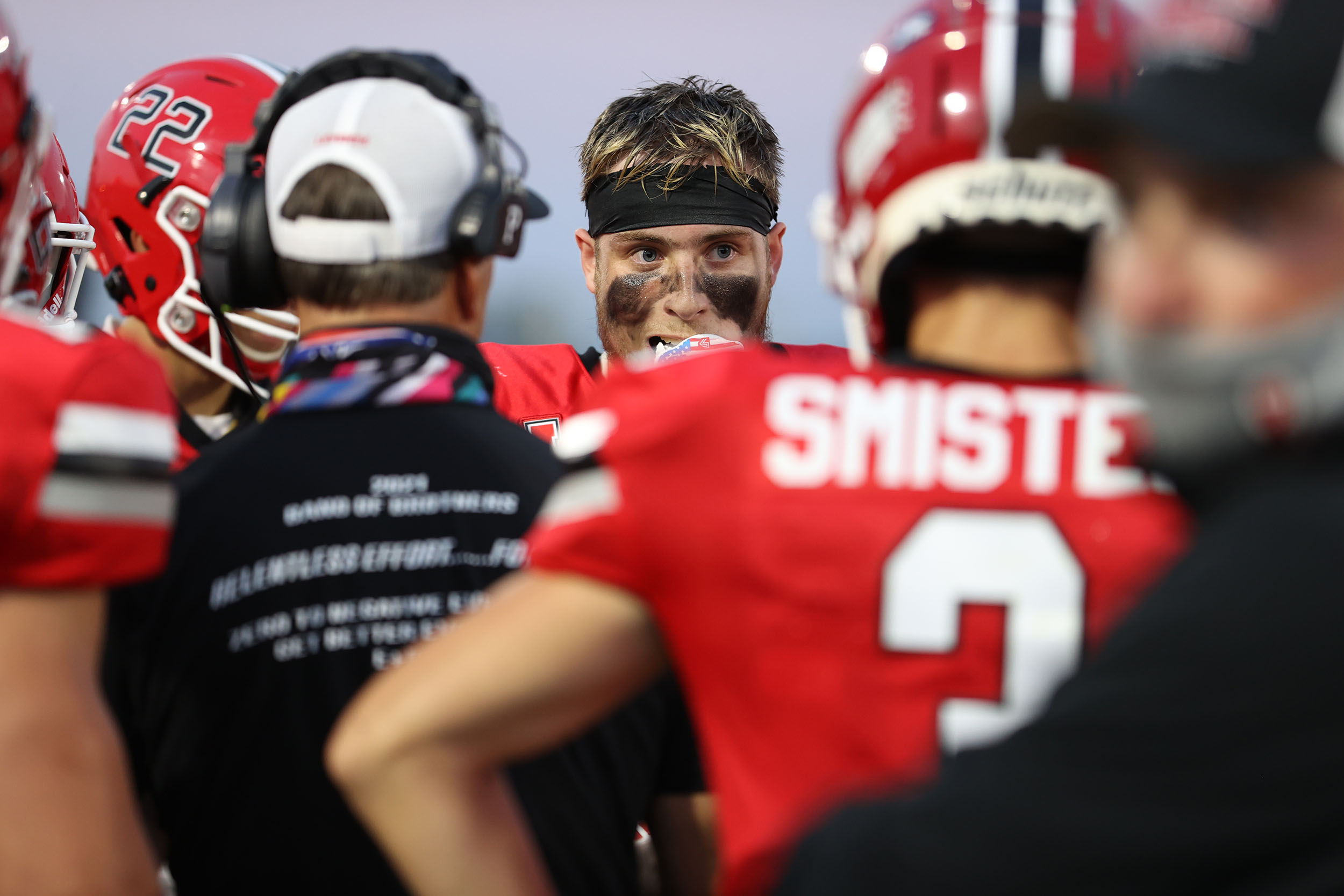 Lancaster football player Zimmerman talking to the coaches in a timout