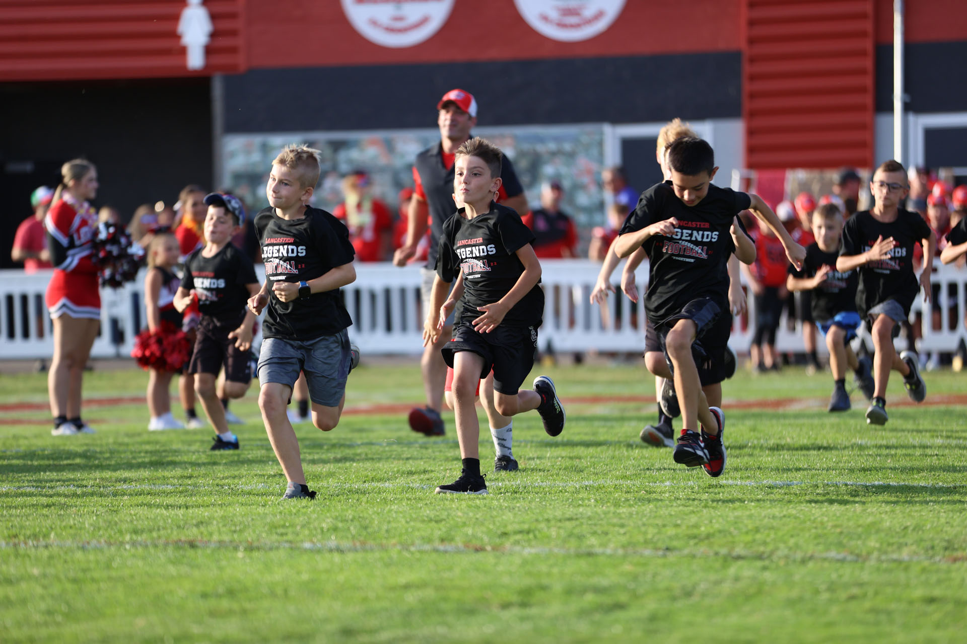 Lancaster Kids running out on the field