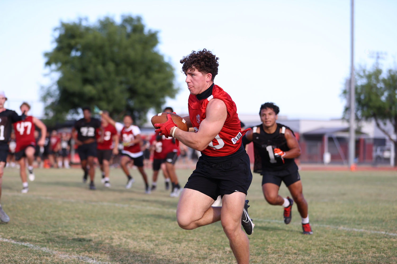 Receiver with the ball running down the field