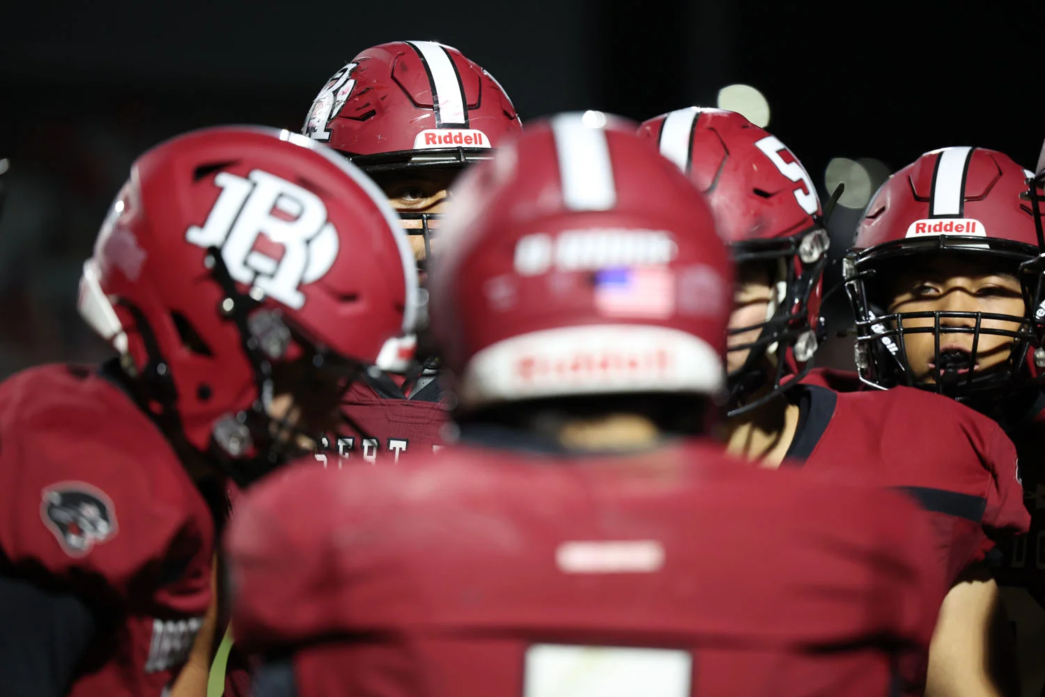 Lineman eyeing the huddle during a timeout