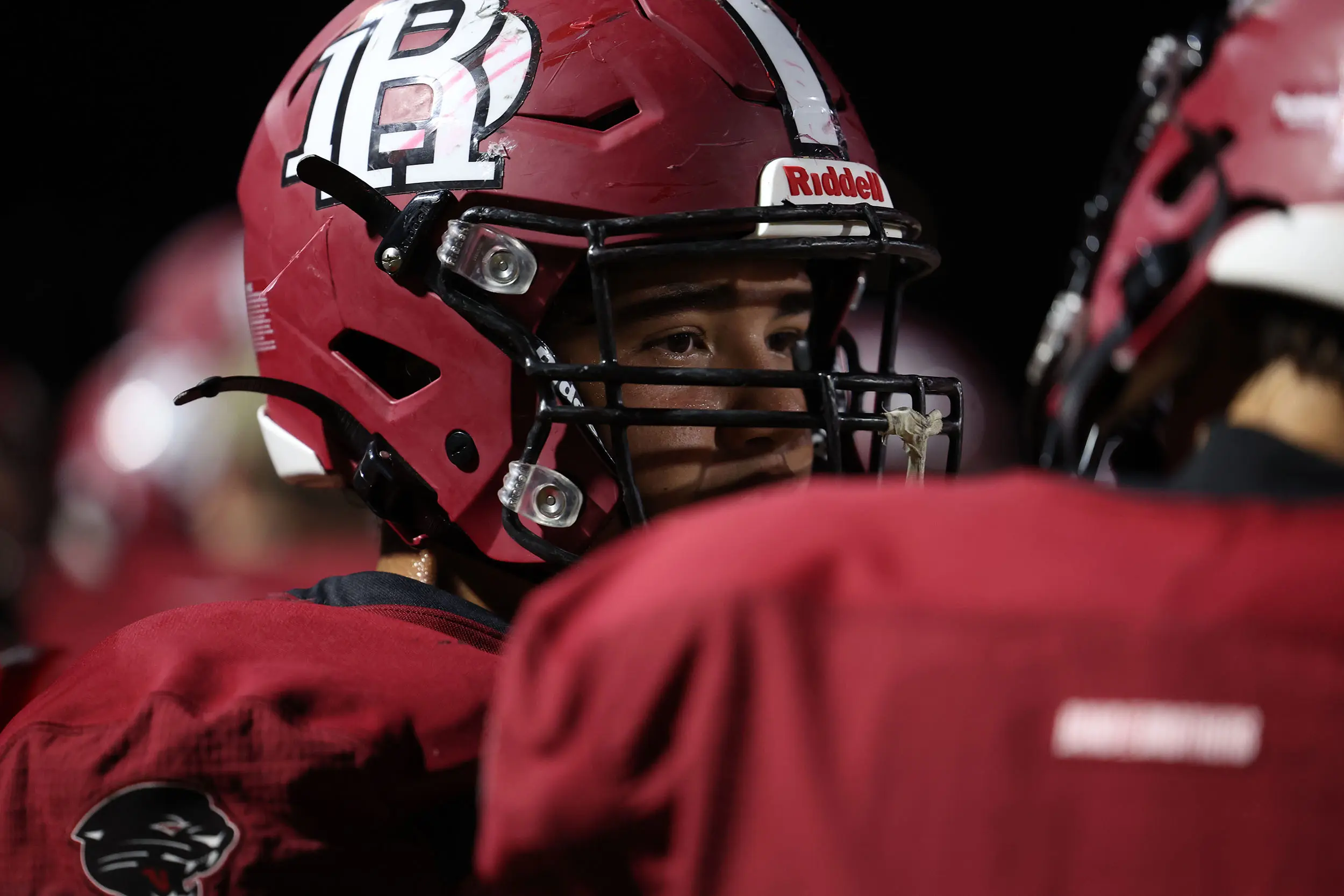 Desert Ridge teammates talking on the sidelines