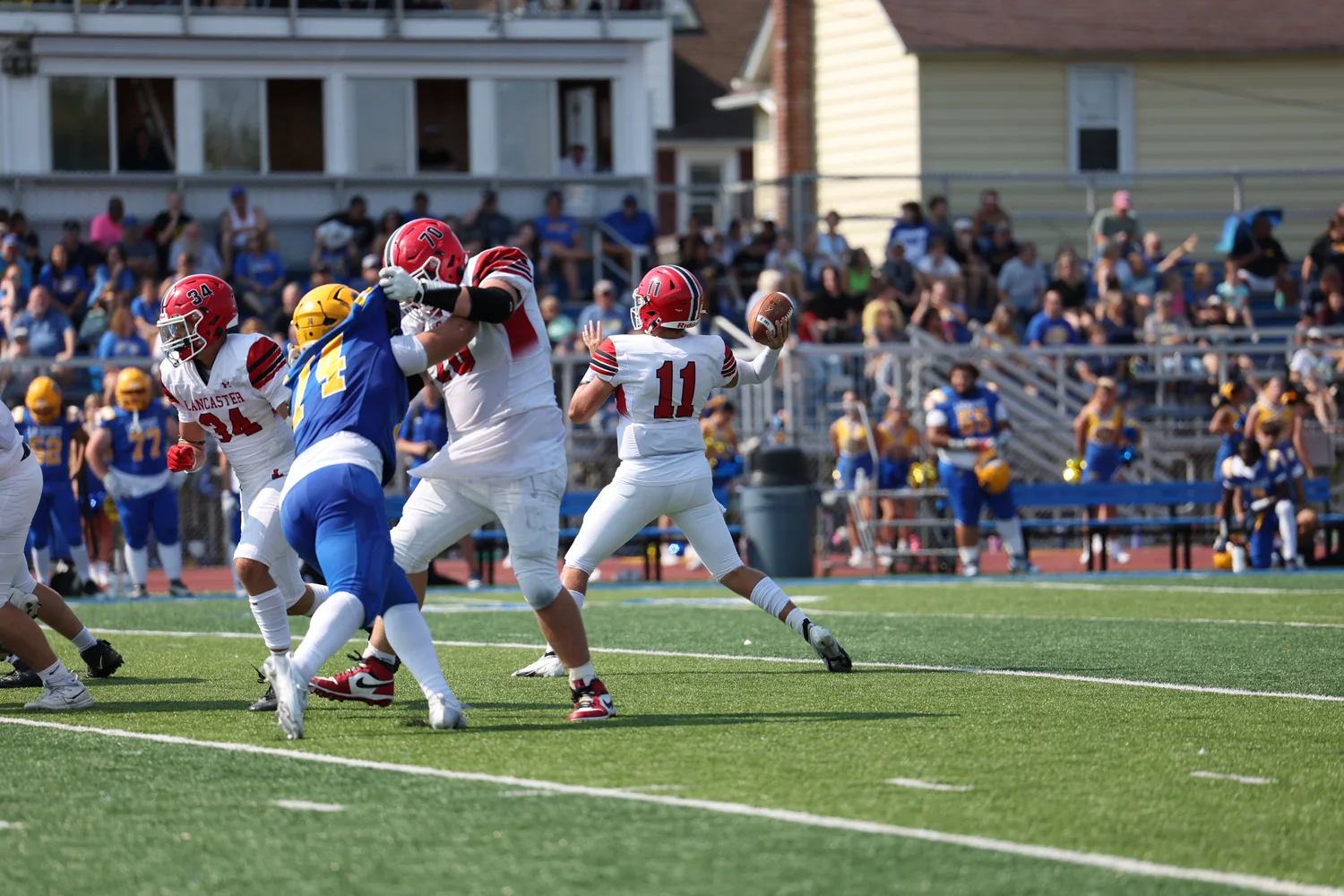 Lancaster QB in the pocket throwing the ball