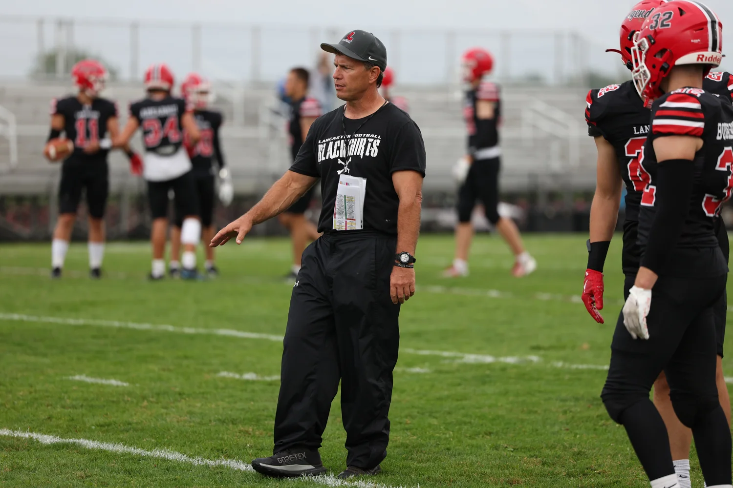 Coach Mansell coaching up the team in pregame