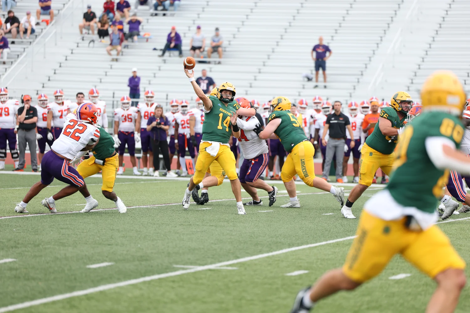 QB throwing down field to his WR